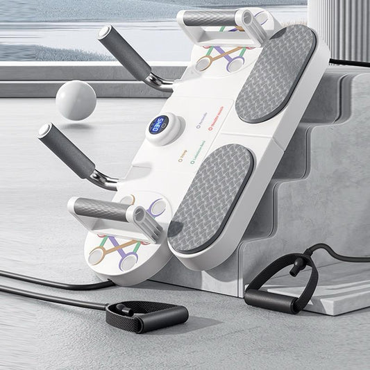 White exercise machine with handles and digital display on a light gray surface.